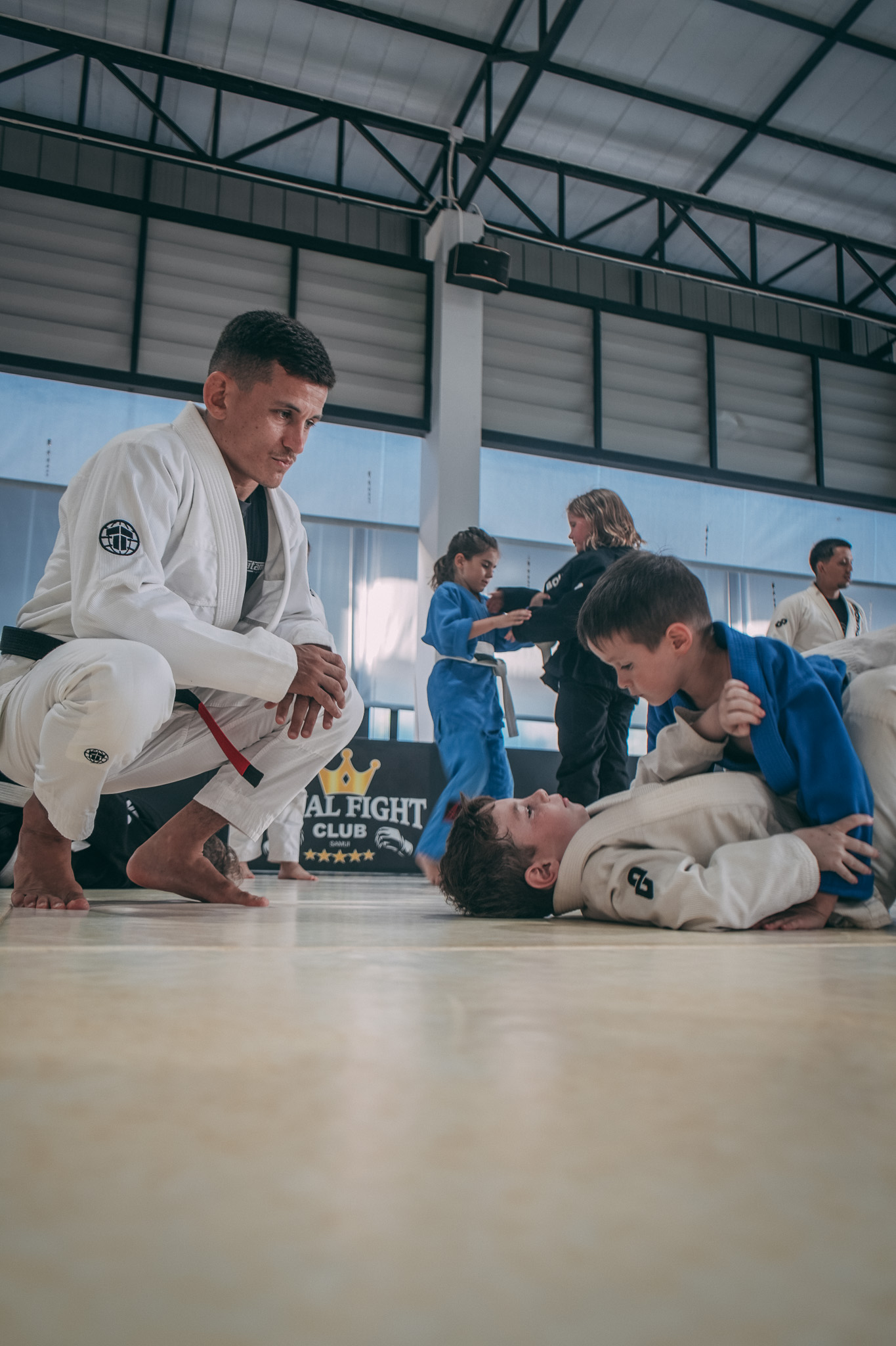 Lucas coaching kids BJJ class